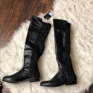 Black over the knee boots.